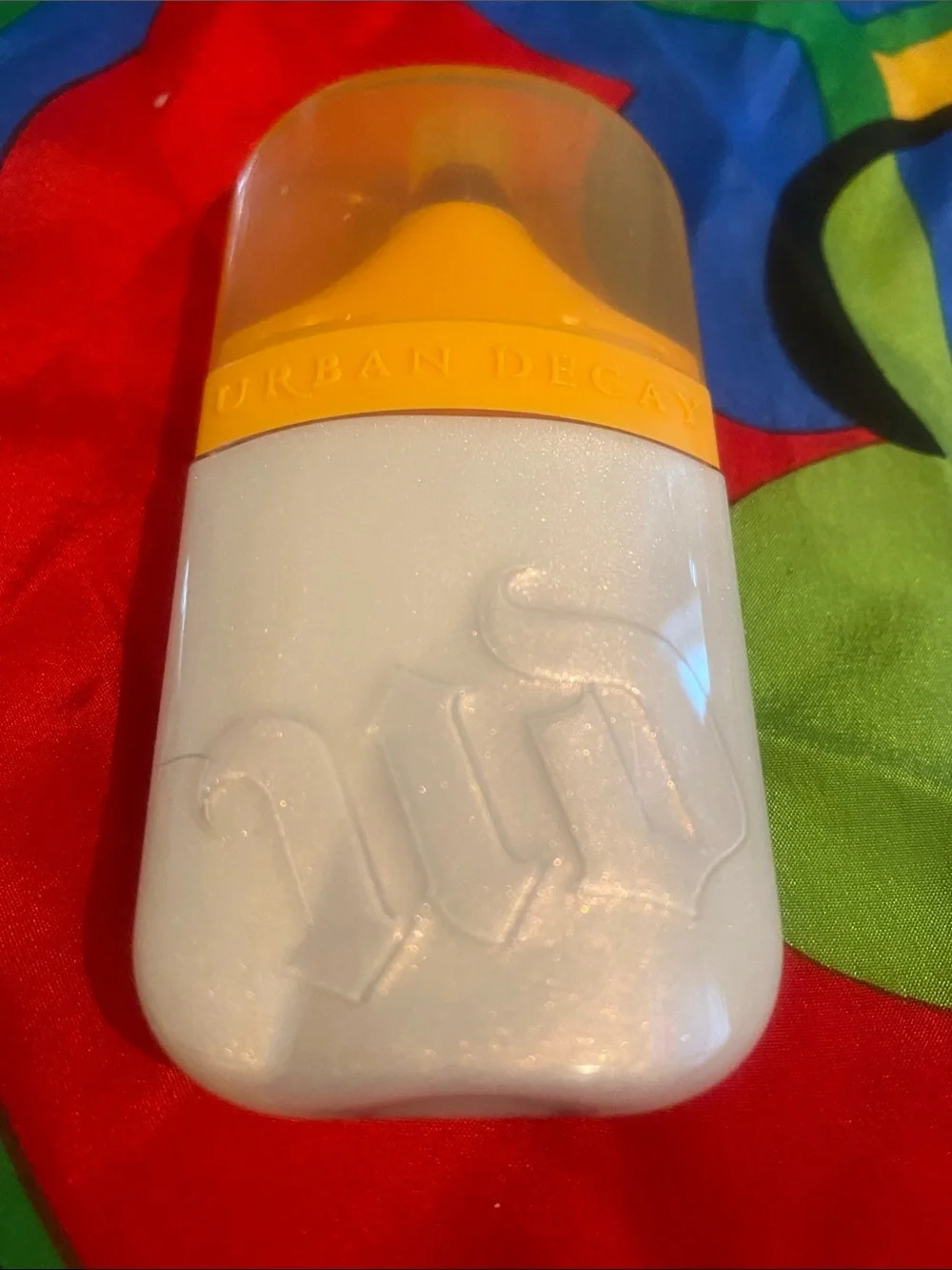 Urban Decay Face Bond Luminizer - Pink and Yellow Text Packaging